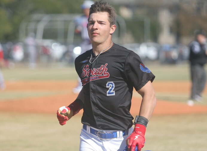 baseball player running between bases