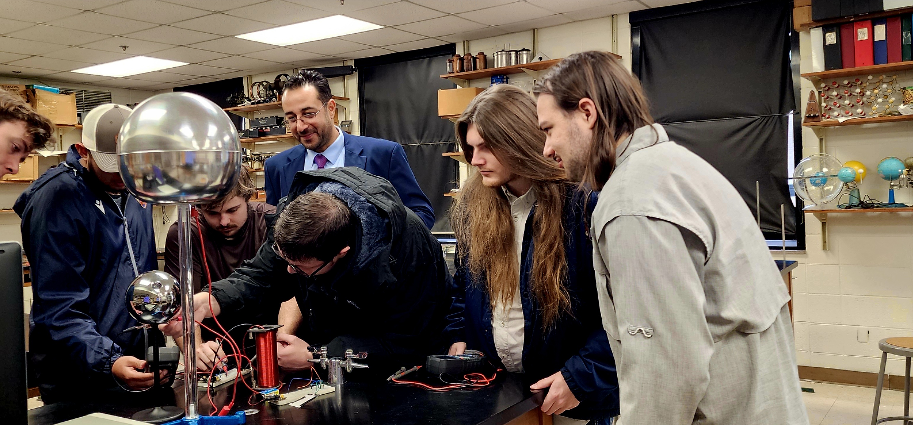 Dr. Rauf Tailony is shown working with SGSC Mechanical Engineering Technology students.
